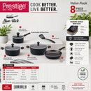 Prestige 8-piece non-stick cookware set in a value pack presentation, featuring multiple black and dark gray pans and cookware pieces with dimensions, capacities, and feature callouts on a white background.
